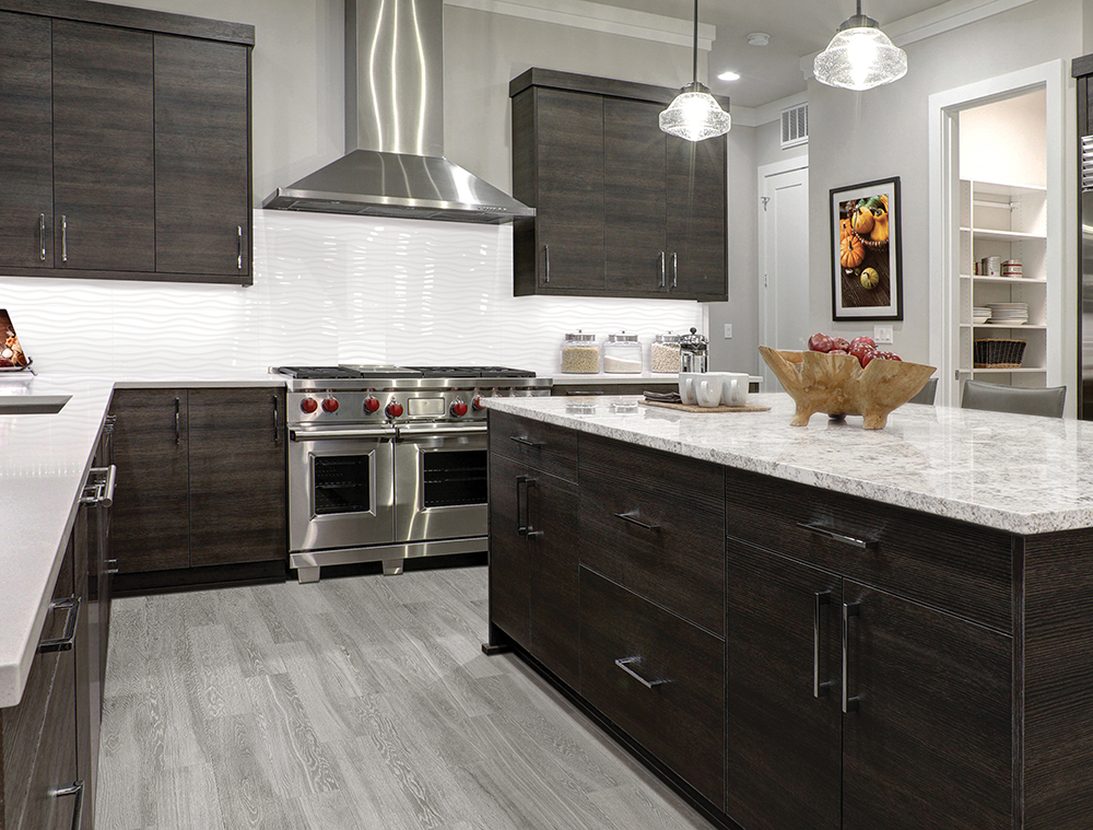 Modern gray kitchen features dark gray flat front cabinets